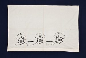 White cotton with Broderie Anglaise, belonged to Esther Modiano.