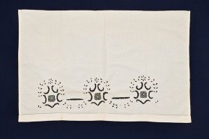 White cotton with Broderie Anglaise, belonged to Esther Modiano.