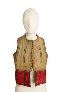 Red velvet waistcoat, heavily trimmed with gold cords and braid, gold knot buttons.