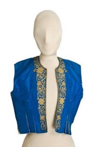 Blue silk waistcoat with round close-fitting neckline, front opening and neckline edged with gold cord embroidery.