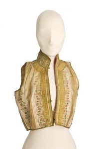 Cream silk brocade waistcoat with woven floral stripes, gold embroidered standing collar and gold braid trimming.