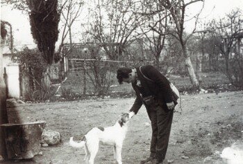 Mavridis George with photographer's paraphernalia and his dog