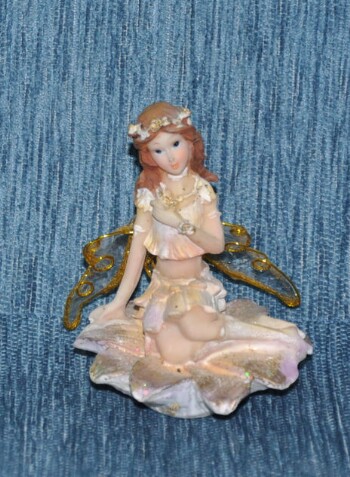 Sitting fairy on flower