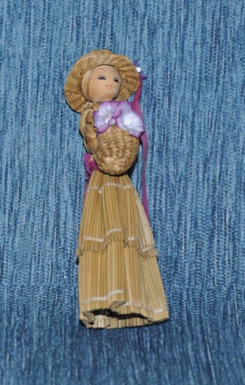 Wooden girl doll with basket
