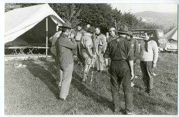 Scouts inspection in front of a tent