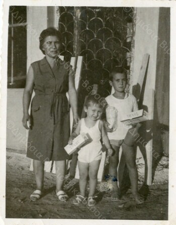 My mother Maria Fotiadis with her children outside the house