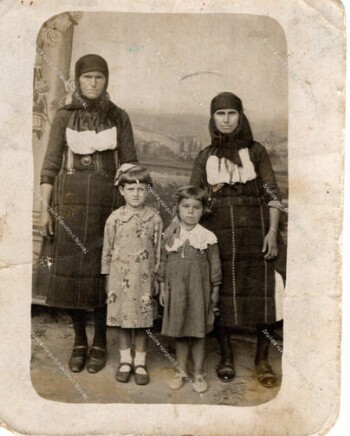 Old times outfits. Grandmothers with their grandchildren