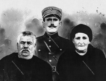 Parents with his son in army uniform