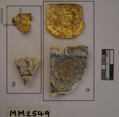 Fragment of gοld-plated glass paste plaque