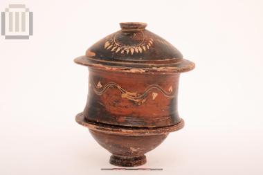 Black-glazed pyxis