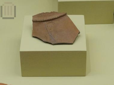 Piece of a vase with engraved scene