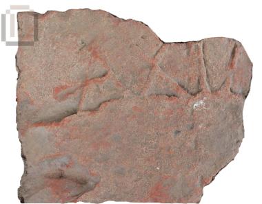 Part of an inscripted brick