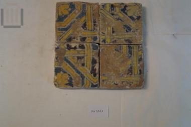 Four ceramic square tiles