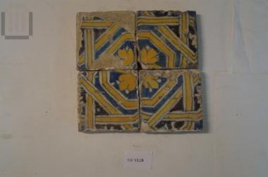 Four ceramic square tiles