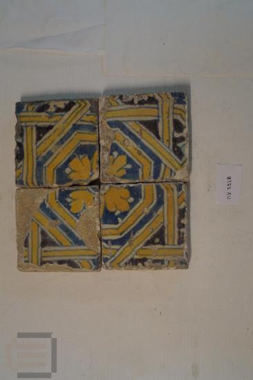 Four ceramic square tiles