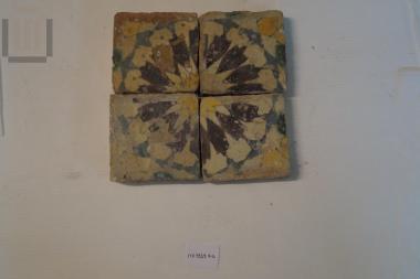 Four ceramic square tiles
