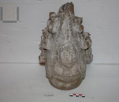 Pitcher with plastic decoration