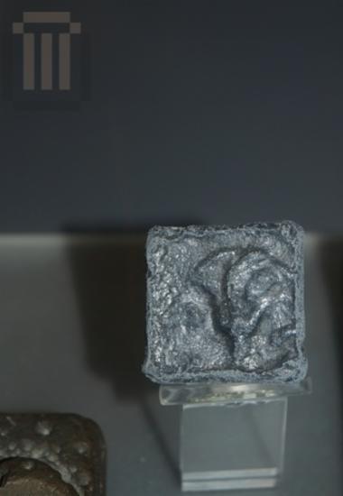 Pyramidal lead weight stamped with the rose symbol