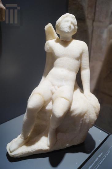 Marble statuette of Ganymede seated on a rock