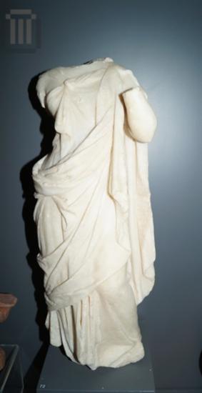Headless marble statuette of Isis