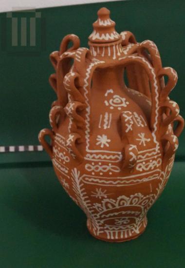 Decorated ceremonial jar with four handles and lid
