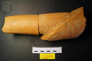 Fragment of a clay statue of a female figure
