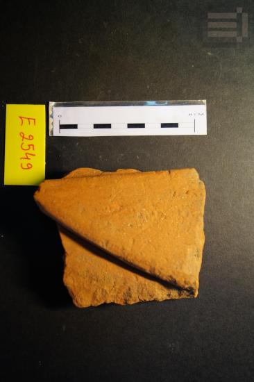 Fragment of a clay statue of a female figure