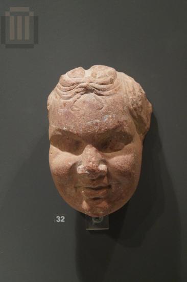 Head of a Satyrisk made of Porphyry (red stone)