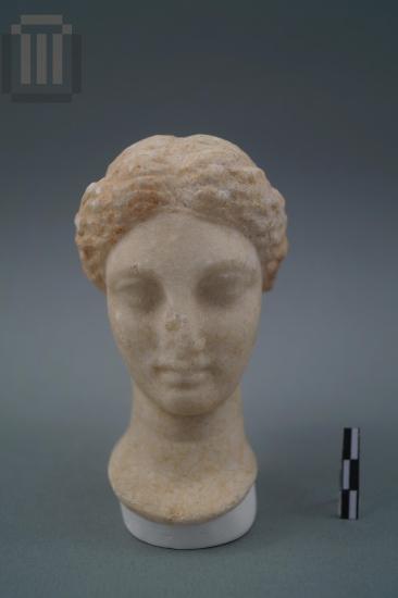 Inset marble head of a female statuette
