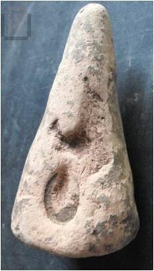 Stamped conical loom weight from Gitana