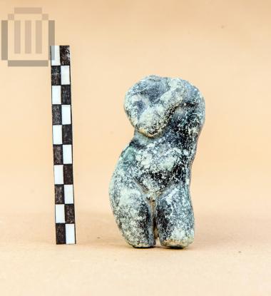 Green stone statuette of a nude youth