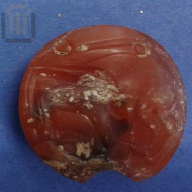 Incised lenticular stone seal