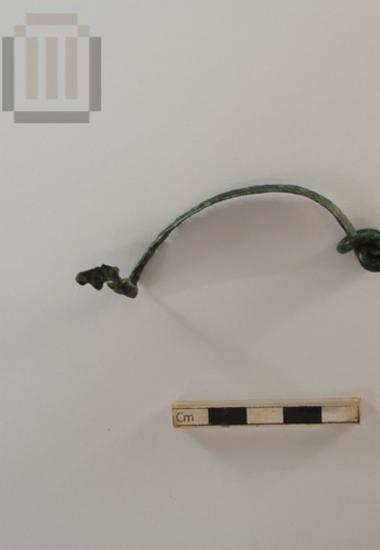 Bronze fibula fragment from Agios Donatos Zervochori