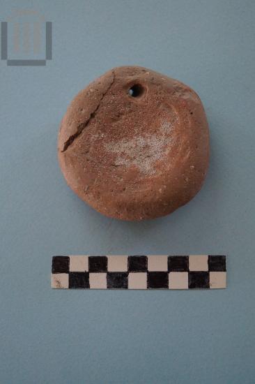 Discoid loom weight with stamped decoration