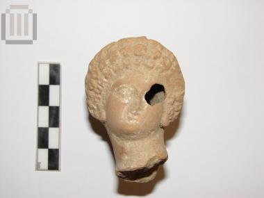 Head from a terracotta figurine of a female figure