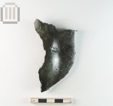 Θραύσμα χάλκινου αγάλματος από τα Γίτανα.