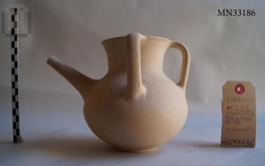 Three-handled clay jug with a tubular spout