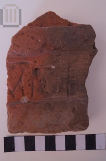 Part of an inscripted brick