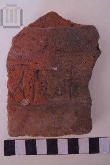 Part of an inscripted brick