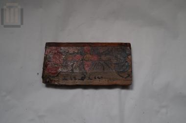 Wooden item with painted decoration