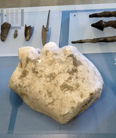 Statue fragment of a male figure