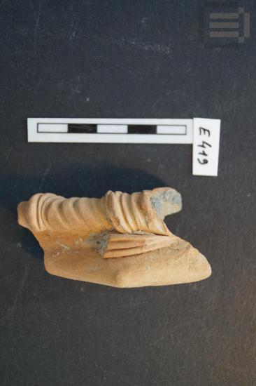 Part of a figurine of a female figure