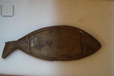 Wooden carved object in the shape of a fish