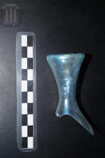 Part of a small glass bottle