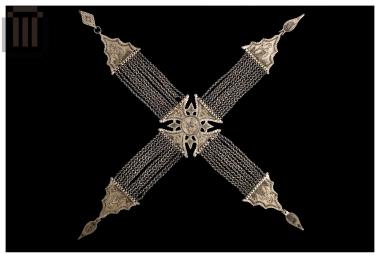 Crossed kiousteki: breast ornament