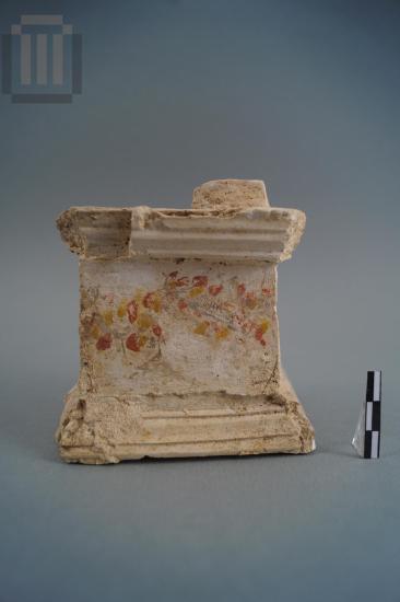 Small poros stone altar coated with plaster with painted decoration
