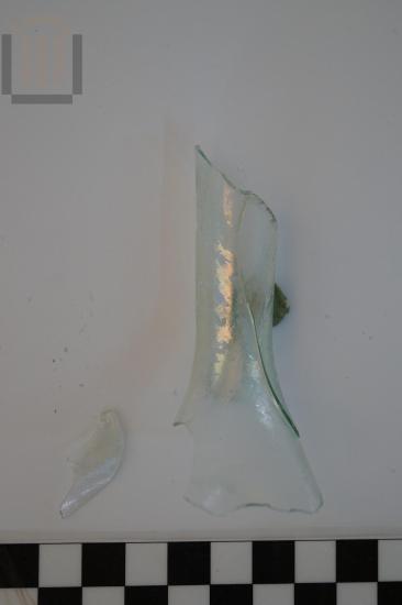 Part of a small glass bottle