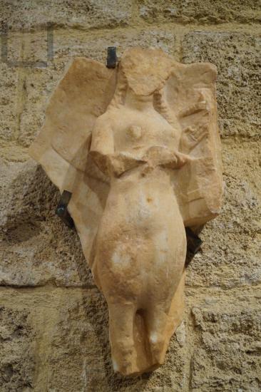 Crowning of a marble grave stele decorated in relief with a Siren playing the kithara (Citharoedus)