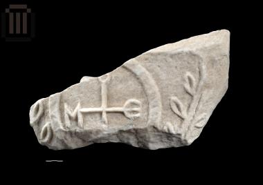 Fragment of impost capital with embossed cross and the letters Μθ and [.] ΟΥ