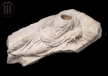 Sarcophagus lid with relief decoration of reclining human figure
